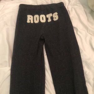 Black roots pants with the logo in the back.